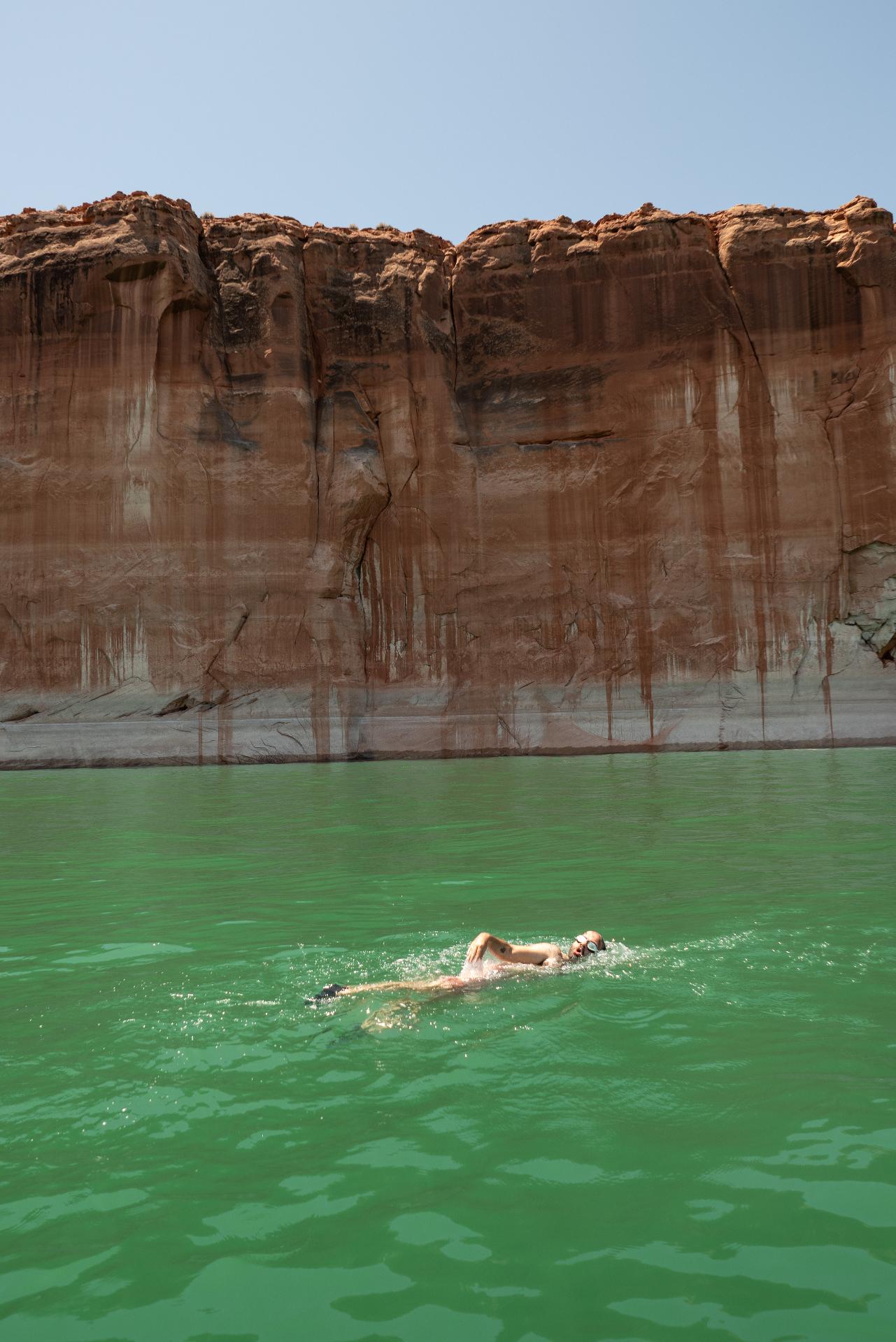 Red rock cliffs over the lake