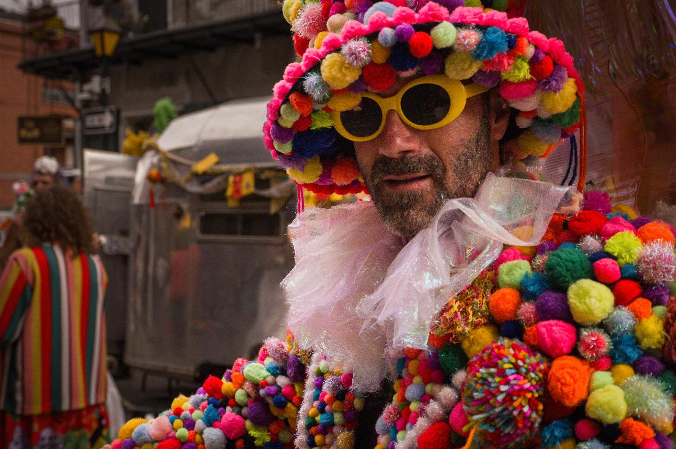 Colorful pom-pom costume at Mardi Gras