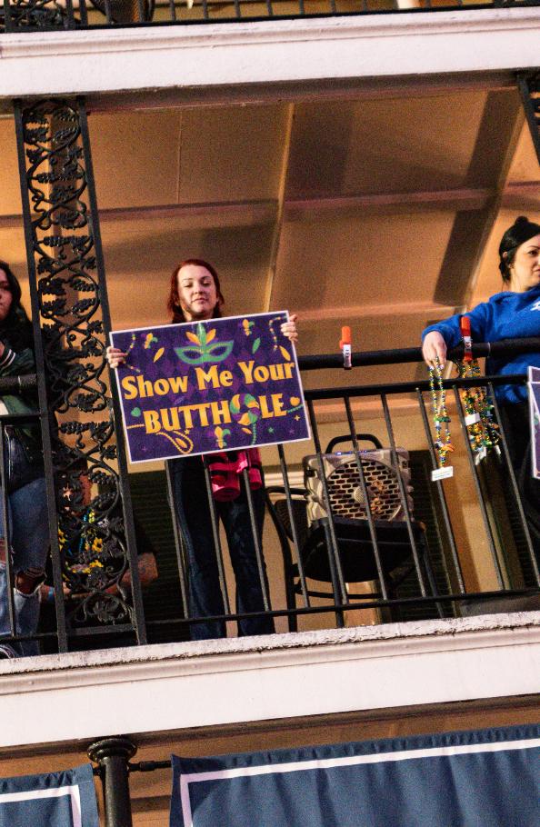 Only in New Orleans — Mardi Gras balcony signs