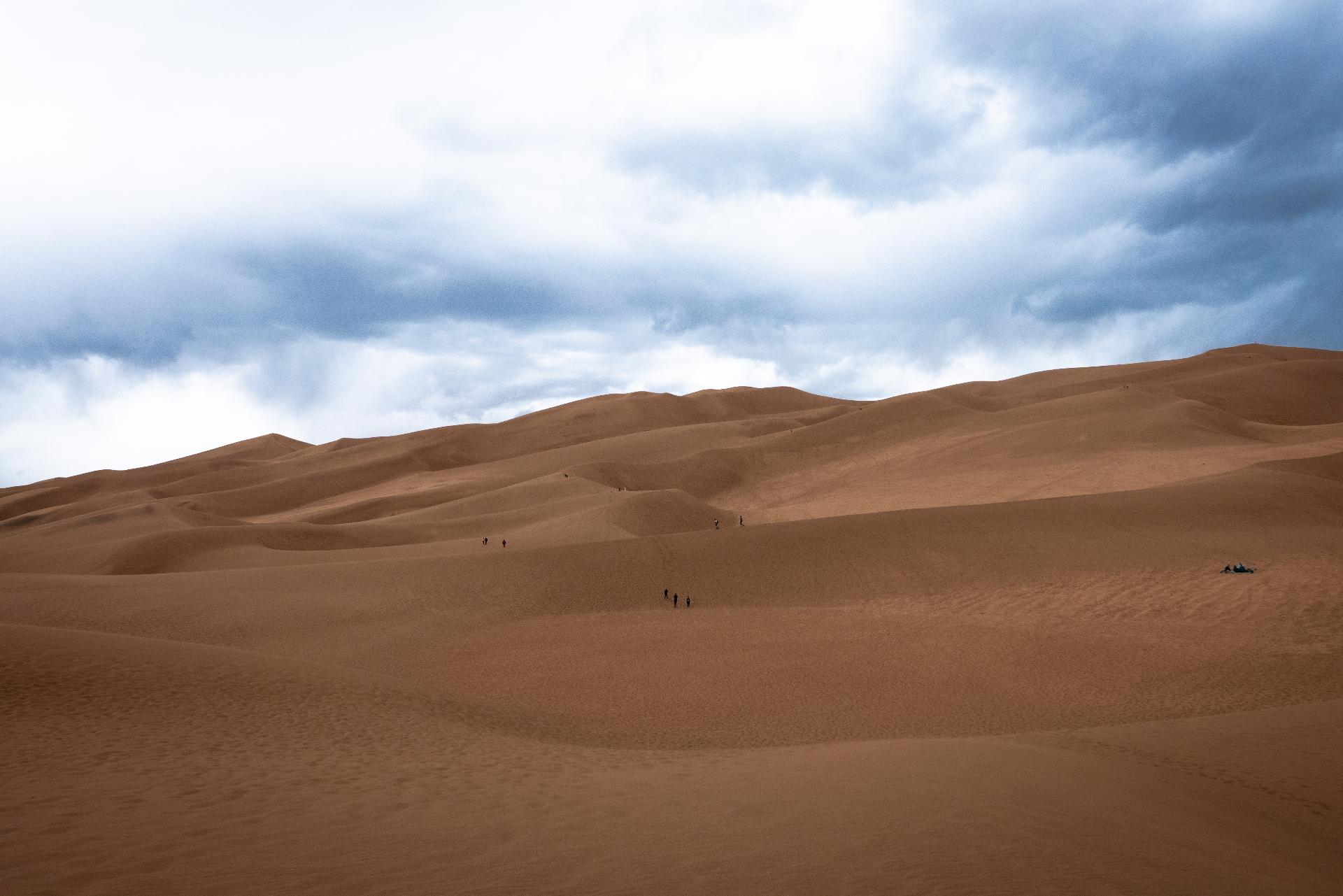 Dramatic dunes under stormy skies