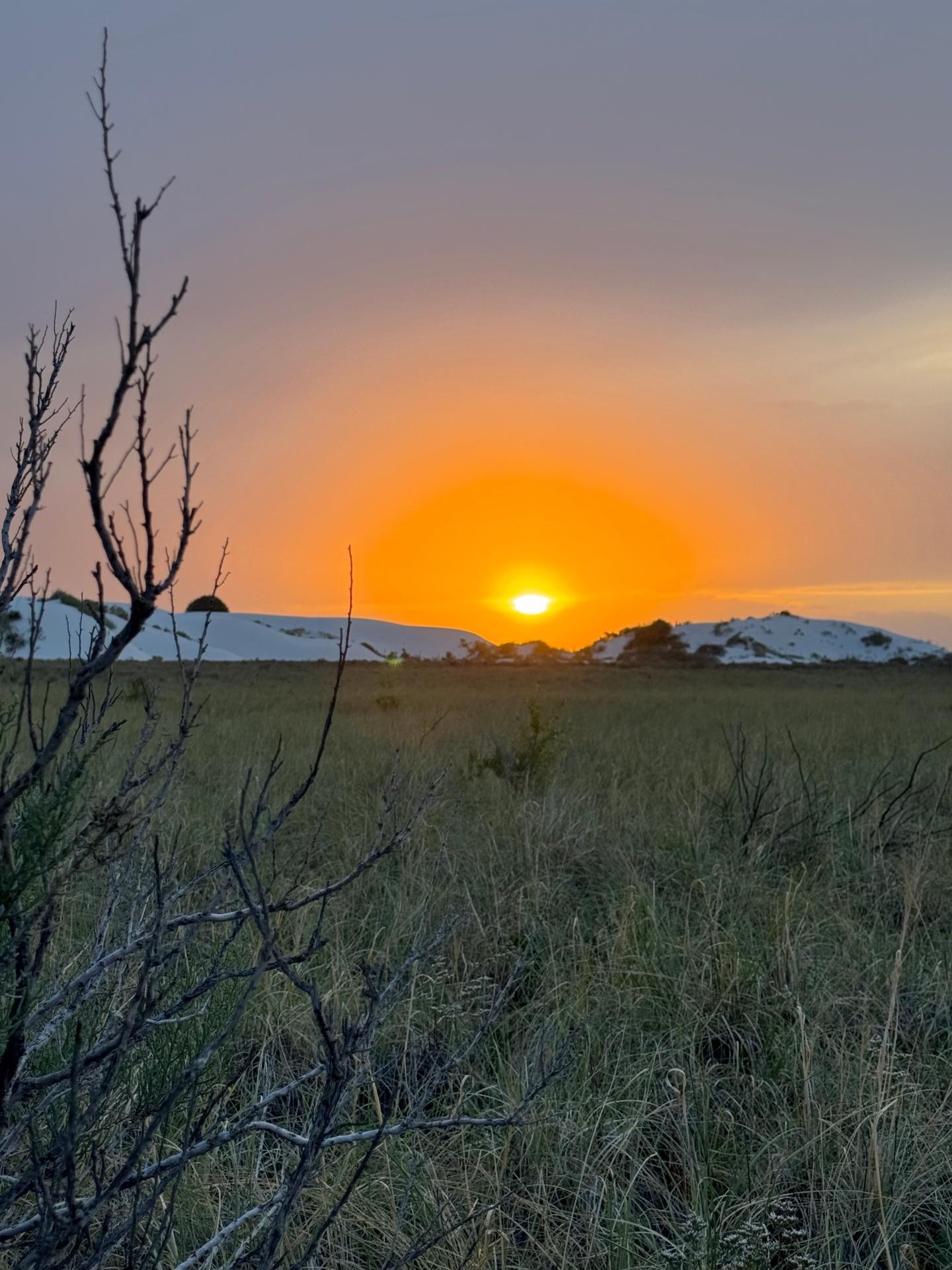 Golden sunset over gypsum dunes