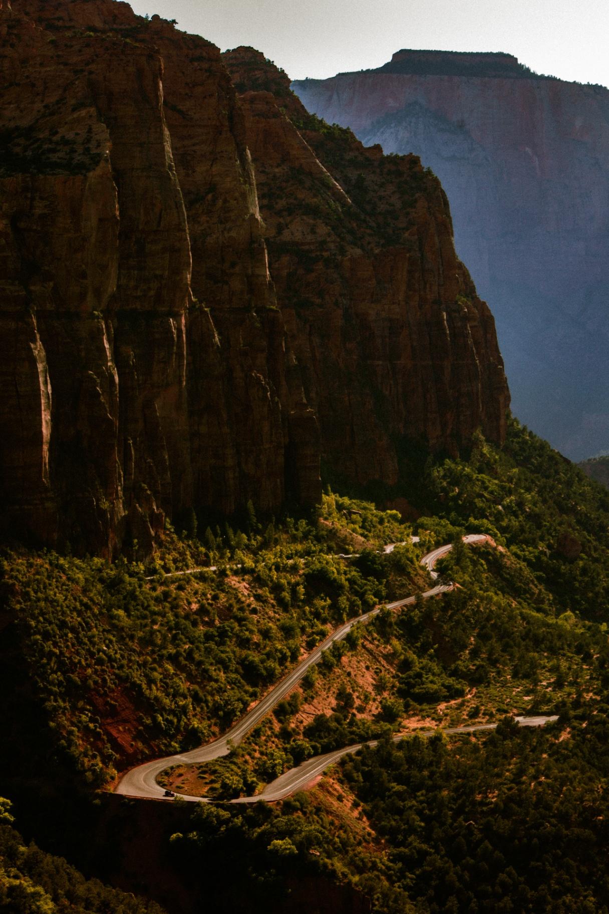 Canyon road winding through red cliffs